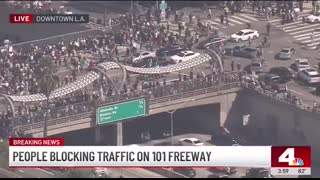 Protesters take over 101 Freeway in downtown Los Angeles