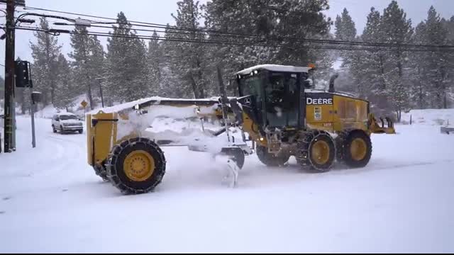 Cars sliding on Maple Lane after recent snowfall in Big Bear, CA