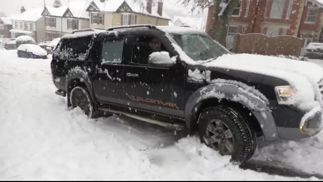 Cars slipping, sliding and crashing in heavy snow in Gloucestershire