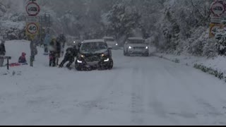 Cars slipping, sliding and crashing in heavy snow in Gloucestershire