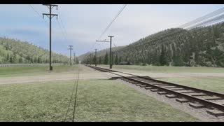 Milwaukee Road F6 Steam Locomotive passes a railroad crossing