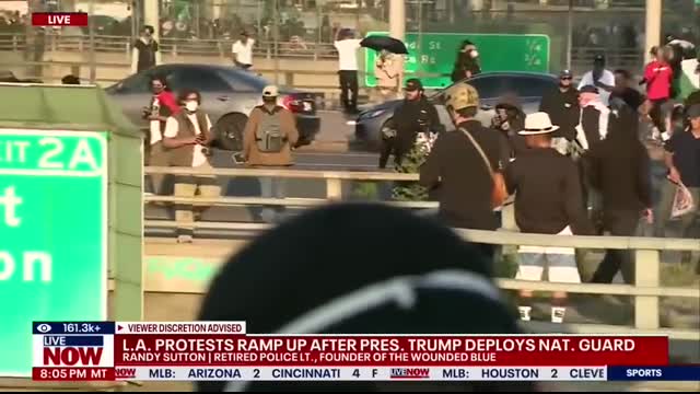 Anti-ICE protesters throw rocks at California law enforcement vehicles on freeway in Los Angeles
